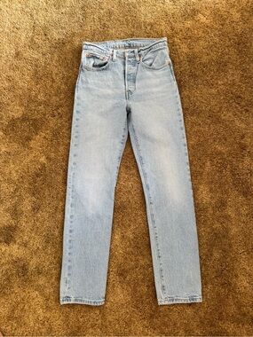 Light wash Levi's 501 straight leg jeans; perfect condition